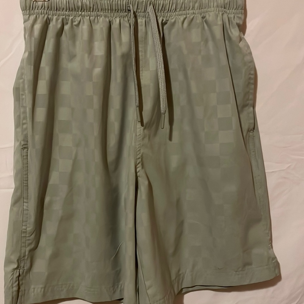 Light silver jogging shorts with stretchable and drawstring waist for comfort